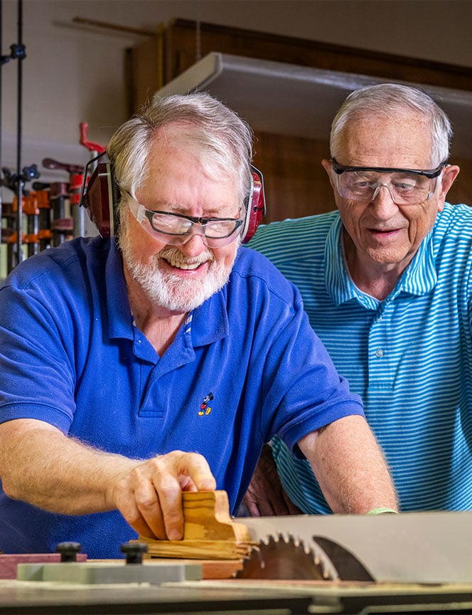 senior men in a wood working shop